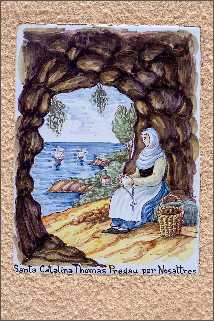 A decorative tile on a house in Valldemossa, Mallorca by Maggie Booth Photography